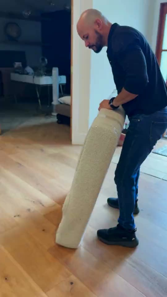 Mover wrapping a large piece in protective padding