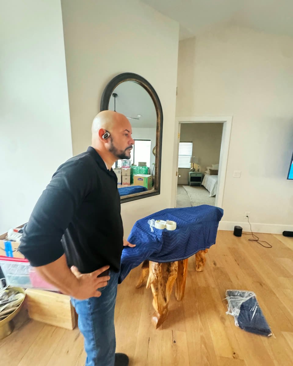 Mover with a table wrapped in a moving blanket