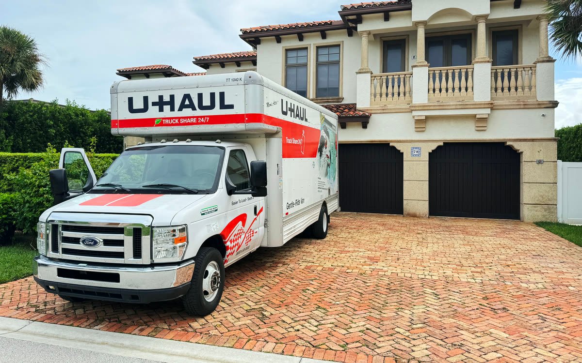 Moving truck parked in a client’s driveway