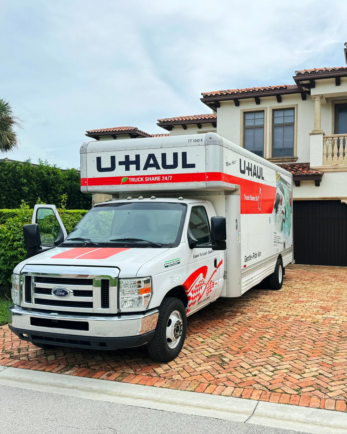 Moving truck in a client’s driveway for a movers-plus-truck job