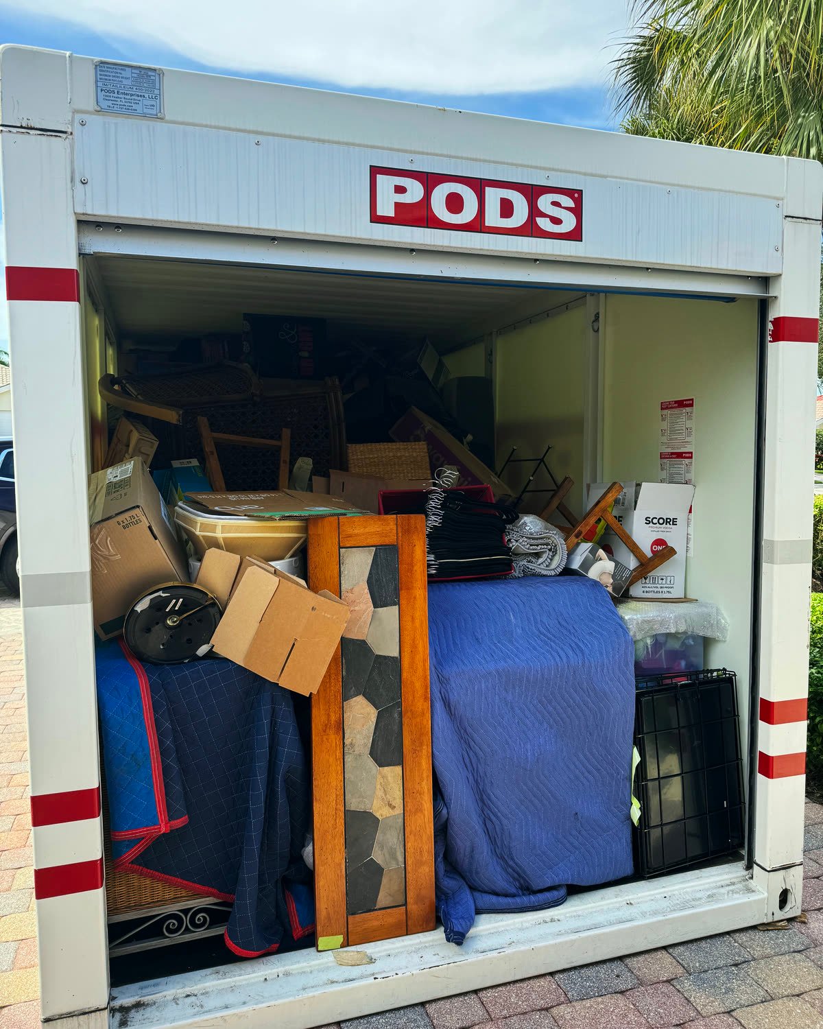 PODS container loaded with furniture wrapped in moving blankets