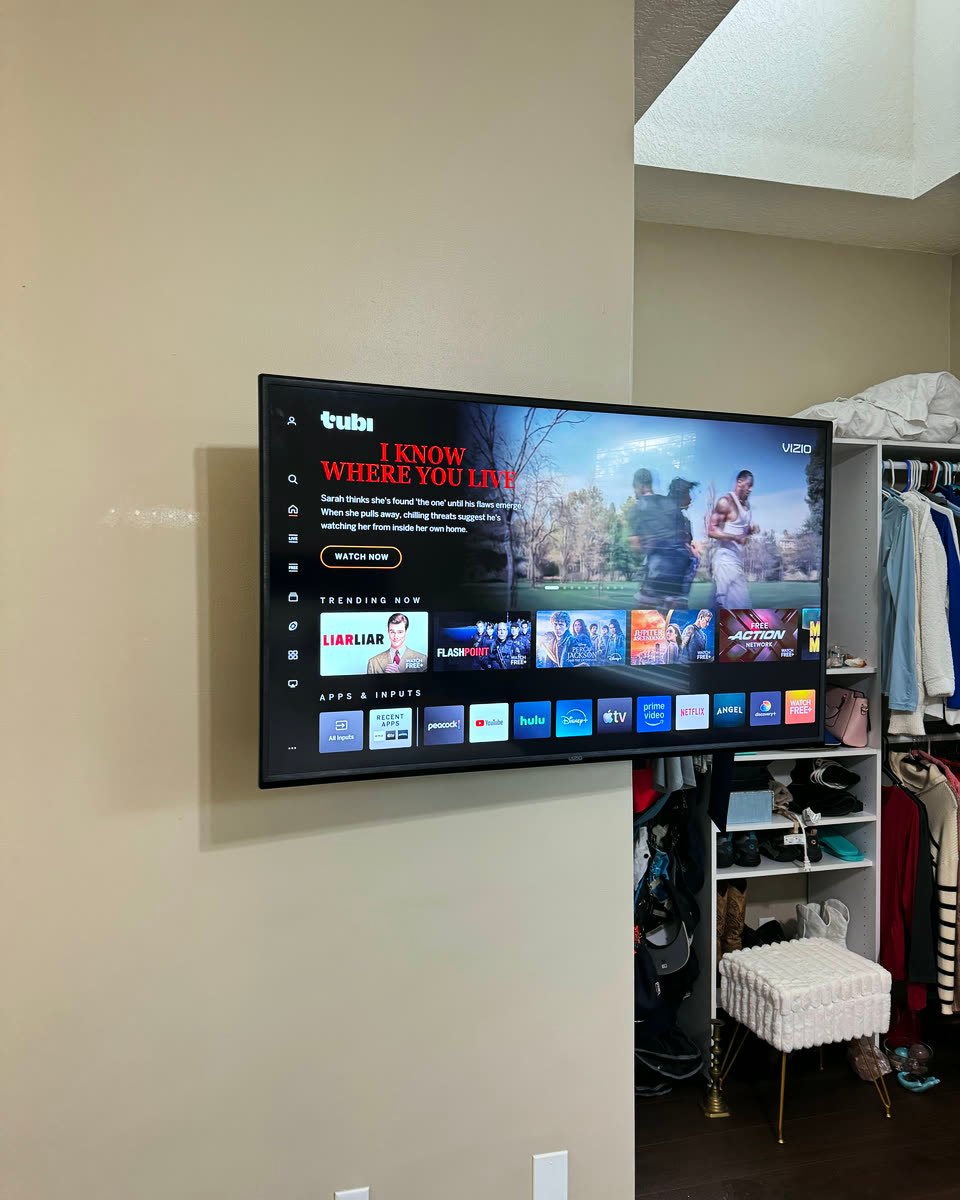 TV mounted level on a bedroom wall by our crew